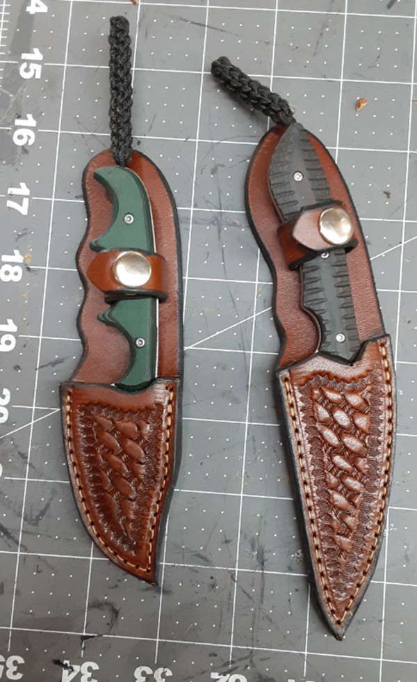2 knives with sheaths