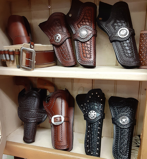 leather holsters on a shelf