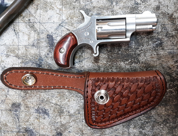 a hand tooled gun holster 14